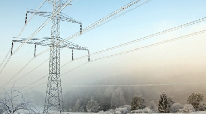 snow and ice cover an electrical tower